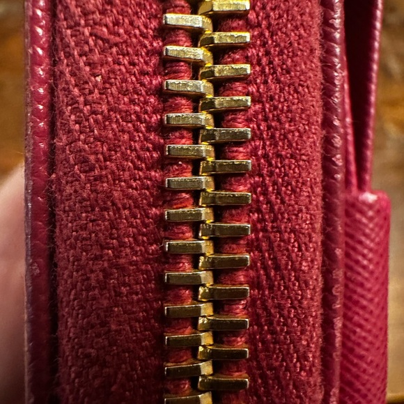 Authentic Prada Elegant Bow Wallet in dark pink/purple color. - Picture 10 of 16